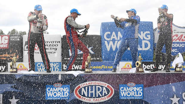 NHRA Charlotte winners (from left): Doug Kalitta (Top Fuel), Bob Tasca III (Funny Car), Greg Anderson (Pro Stock) and Gaige Herrera (Pro Stock Motorcycle) celebrate their respective wins in Sunday's playoff race near Charlotte, N.C. Photo courtesy NHRA.